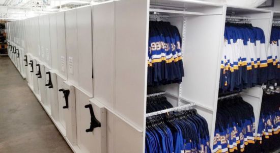 A room filled with sport jerseys on racks, organized in an activRAC system.