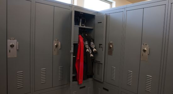 Double door personal storage lockers in a police station locker room.