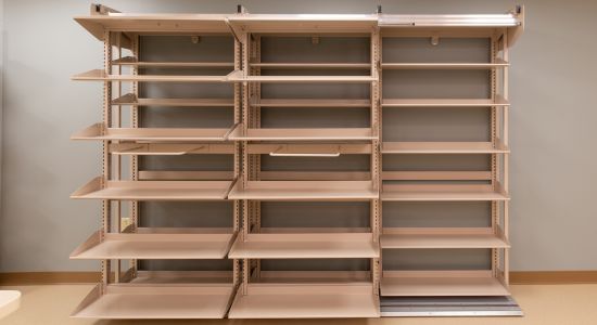 FrameWRX pharmacy shelving: a shelving unit featuring numerous shelves, ideal for organizing pharmacy supplies.