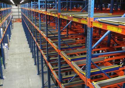 Efficient warehouse with pushback racking system and ample storage.