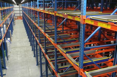 Efficient warehouse with pushback racking system and ample storage.