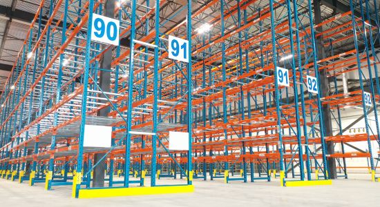 Spacious warehouse with selective pallet rack system.
