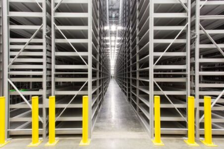 Compact high-density shelving for organized warehouse storage.