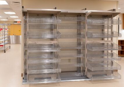 An image of a Spacesaver frame WRX storage system featuring a spacious metal rack containing multiple baskets.