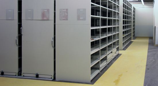 Spacious room with mobile trim-line shelving units.