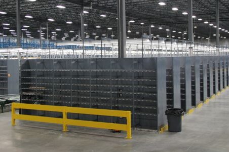 An expansive warehouse housing countless shelves and racks, featuring type 1 shelving.