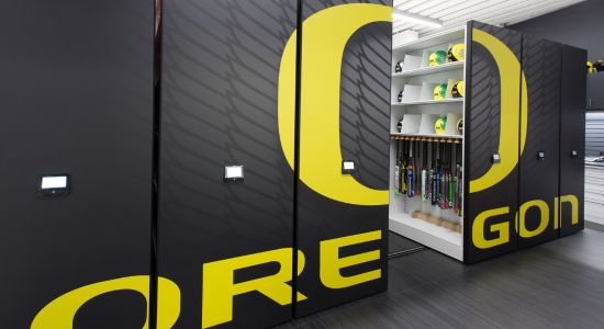 A organized softball equipment room with a mobile storage system, optimizing space usage.