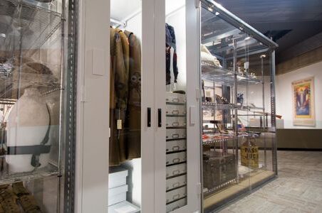 Viking preservation cabinet displaying museum collections in glass case.