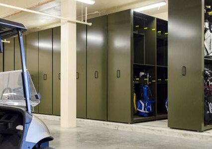 A mobile storage unit showcasing golf equipment in a locker room, designed by Spacesaver for easy organization and accessibility.