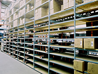Front view of E-Z rect warehouse shelving system with black containers on the shelves