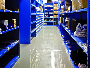 Blue rousseau adjustable shelving filled with products