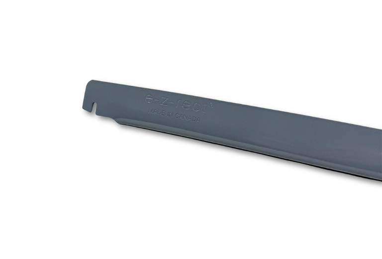 A close-up, angled view of a dark gray E-Z-Rect Type 1 frame connector light duty bar reveals "e-z-rect" and "MADE IN CANADA" embossed on its surface, with a notched end.