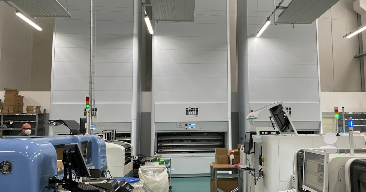 Three Modula Slim VLMs side by side in a small warehouse