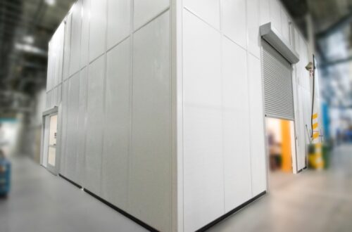 Prefabricated modular office in warehouse with roll up doors